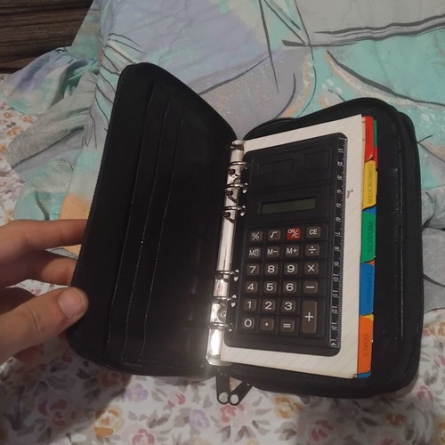 Organizer agenda with zipper used, black color, internal dividers