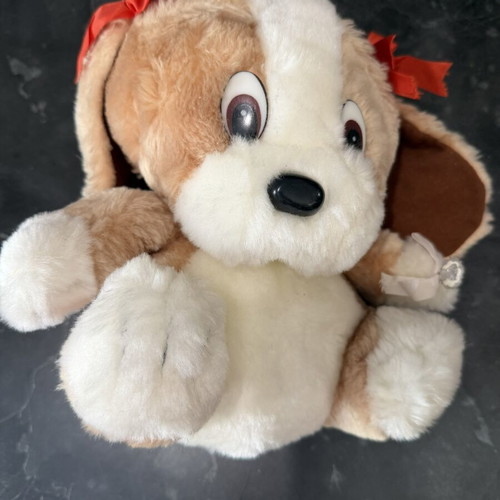 Plush dog with red bows