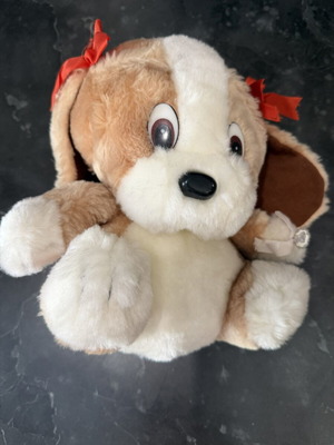 Plush dog with red bows