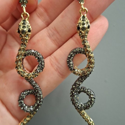 Snake earrings new with black and gold stones