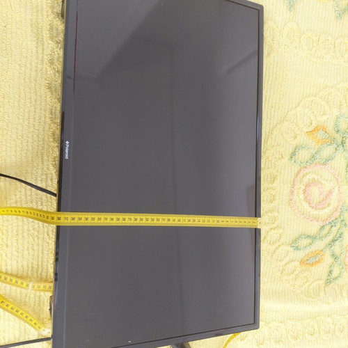 Polaroid TV used with wall mount, 61 cm width, 35 cm height