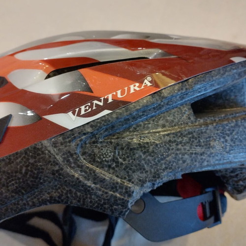 Bicycle helmet used, teen size 54-58 cm with left side wear
