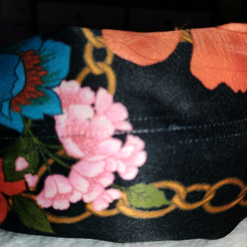 Satin style headband used, multicolor with flowers
