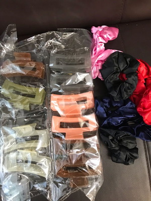 Package of new colorful hair claws and scrunchies
