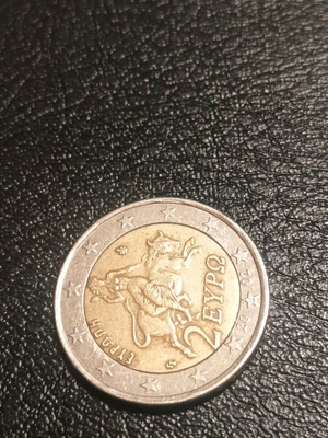 Νομίσματα Ελλάδας μεταχειρισμένα του 2002 και 2025 με απεικόνιση αρπαγής της Ευρώπης