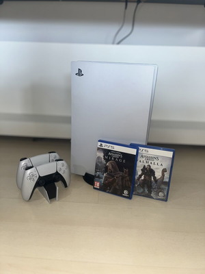 PlayStation 5 console used with two Assassin’s Creed games and DualSense controllers