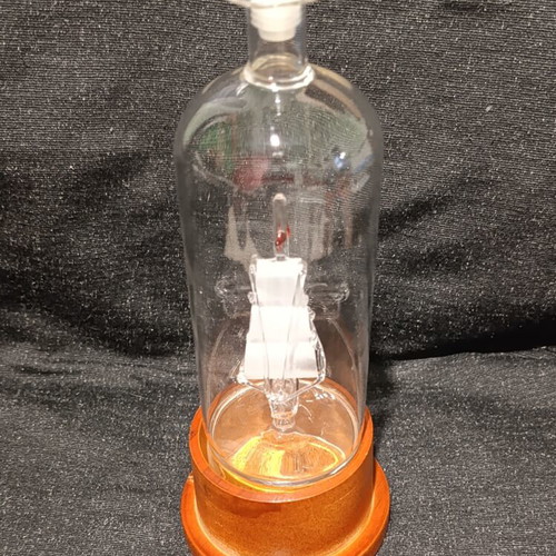 Vintage glass decanter with ship inside, used