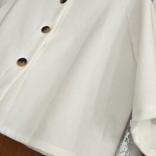 White short jacket with stand-up collar and buttons, minimal style