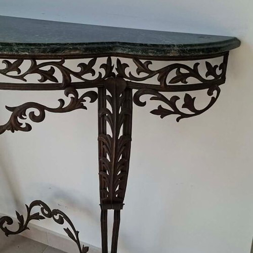 Metal console used with marble top and ornate wrought iron design