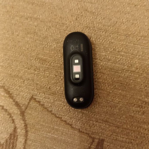 Mi Band smart watch used with charger, strap needs replacement
