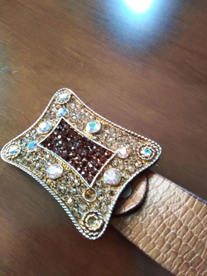 Belt like new with decorative buckle, size 112x0.4, missing 2 stones
