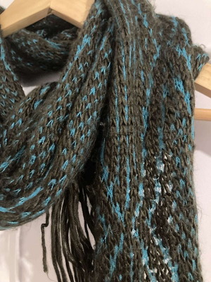 Long scarf used with brown and turquoise two-tone knit