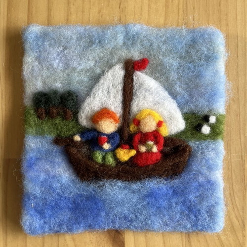 Handmade wool felt wall art with sailing boat and children
