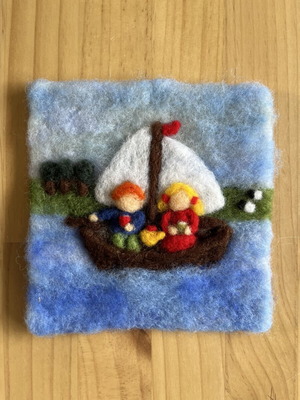 Handmade wool felt wall art with sailing boat and children