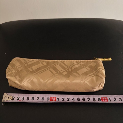 Estée Lauder toiletry bag new, gold color