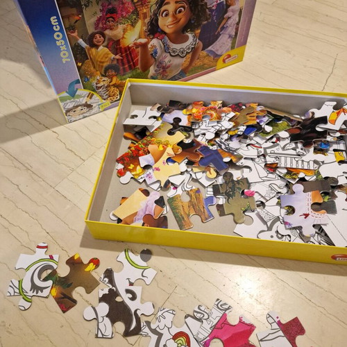 Encanto floor puzzle used, 104 pieces, double-sided