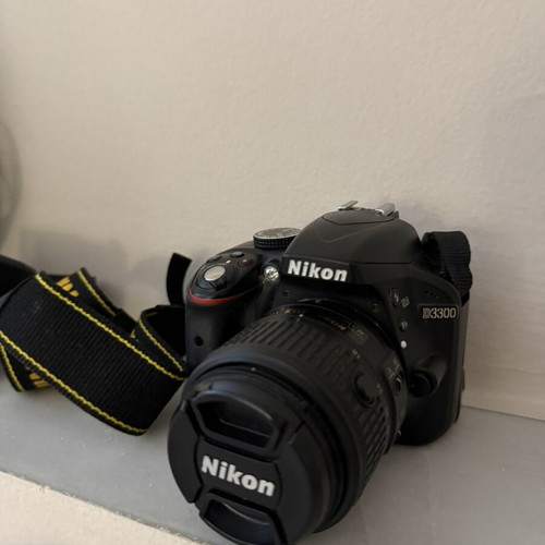 Nikon D3300 camera with 18–55mm lens, case, battery and charger