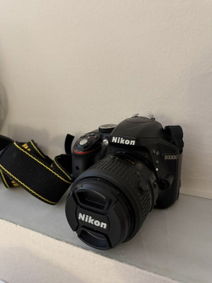 Nikon D3300 camera with 18–55mm lens, case, battery and charger