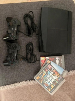 PlayStation 3 console with controllers and games