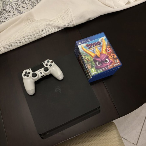 PlayStation 4 Slim used with controller and 7 games, 500GB