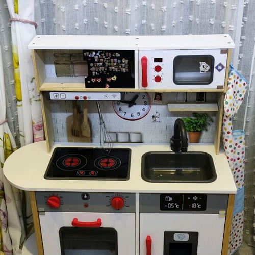 Children's wooden kitchen used with sounds and light