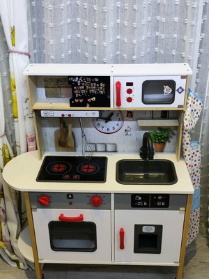 Children's wooden kitchen used with sounds and light