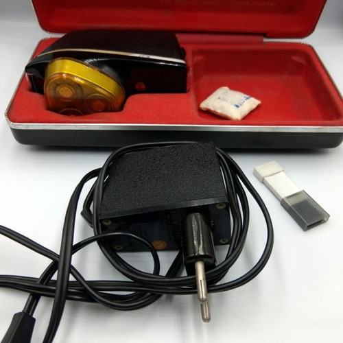 Vintage Norelco electric shaver with case used