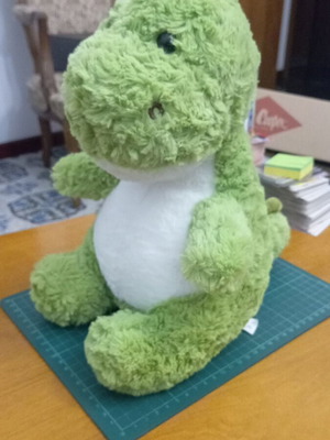 Plush toy green dinosaur like new with fluffy texture and white belly