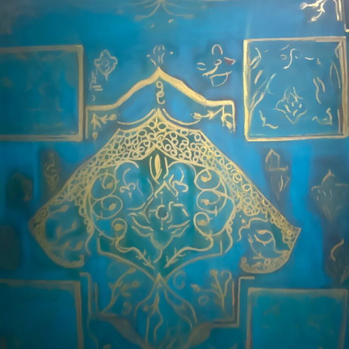 Turquoise board with a gold hamsa hand