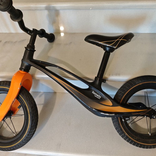 Lionelo Bart Air balance bike used, black orange
