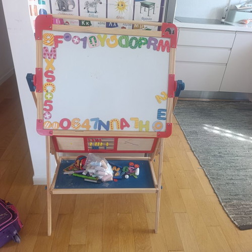 Double-sided educational board with magnetic and blackboard sides