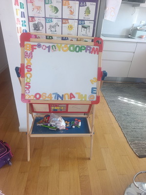Double-sided educational board with magnetic and blackboard sides