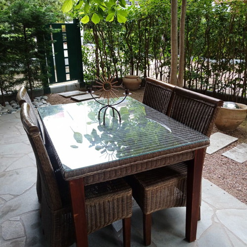 Rattan dining set used, glass table with 4 chairs for indoor and outdoor
