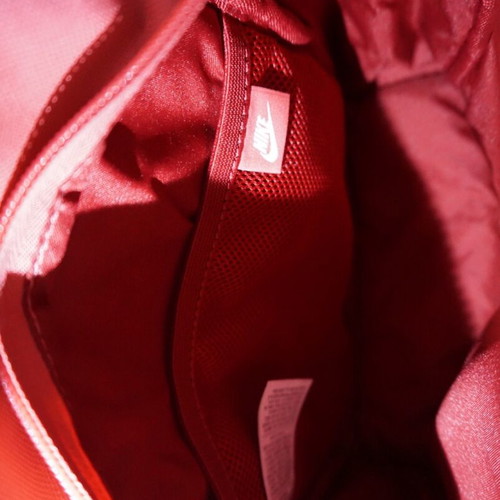 Nike mini backpack like new with gold logo, red