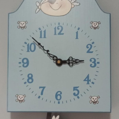 Blue wall clock used for kids room with pirate and dog design