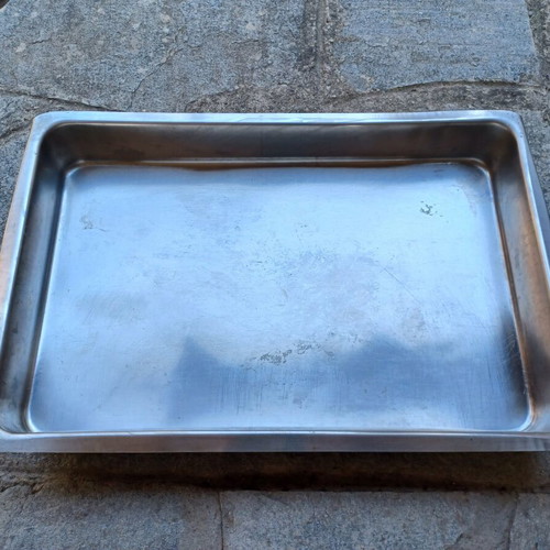 Set of two used stainless steel oven trays