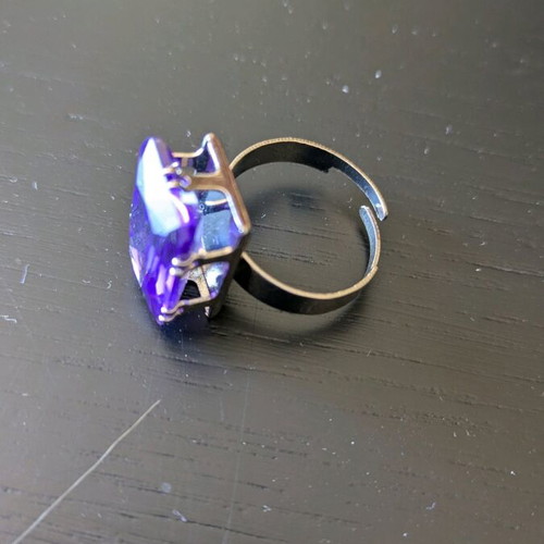 Steel ring like new with purple synthetic stone
