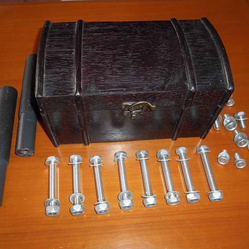 Box with various metal parts and 18 screws used