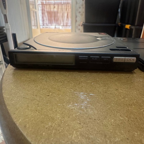 Sony Discman D-100 with battery pack used, missing play button