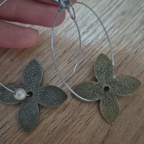 Hoop earrings used with metal flowers and pearl detail