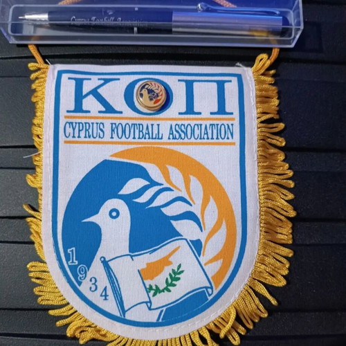 Football memorabilia pack with small pennant, pin, and pen like new