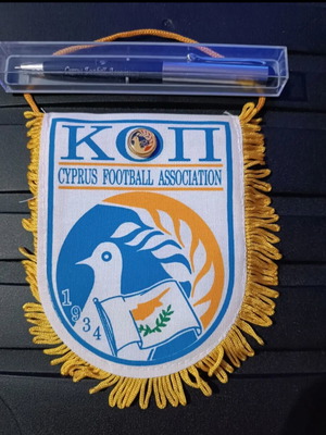 Football memorabilia pack with small pennant, pin, and pen like new