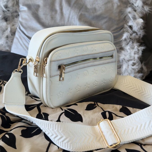 White bag with gold details and unique design, new