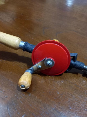 Hand drill used with wooden handles red