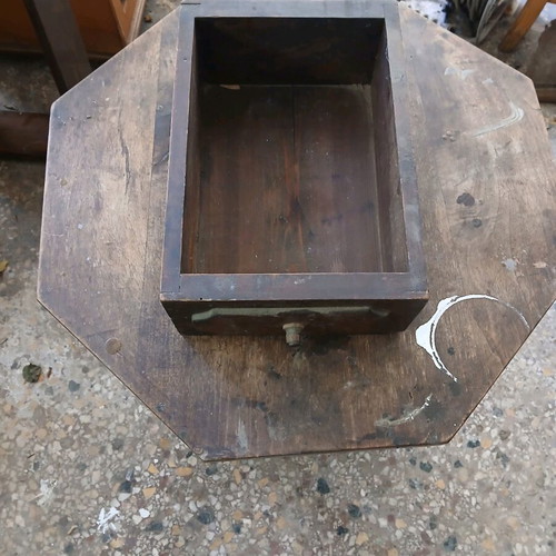 Vintage wooden table used, Victorian era with octagonal surface