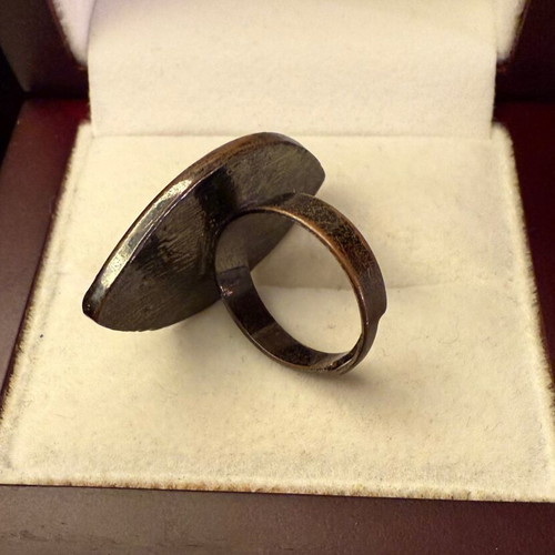 Faux ring used, shiny faux glass, anthracite metal base, adjustable size