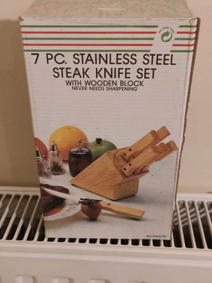 Stainless steel knives new with wooden block