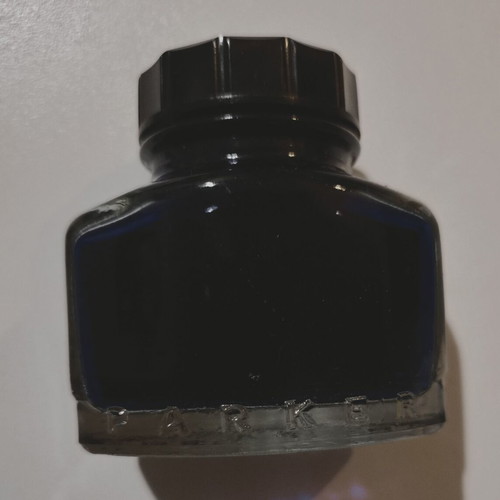 Permanent blue ink "PARKER - SUPER QUINK", in a glass bottle in its box, I think it is full.