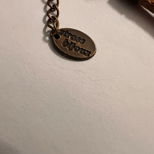 Brown leather necklace with metal floral details and rhinestones like new