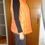 Sleeveless women's jacket like new, size large, orange